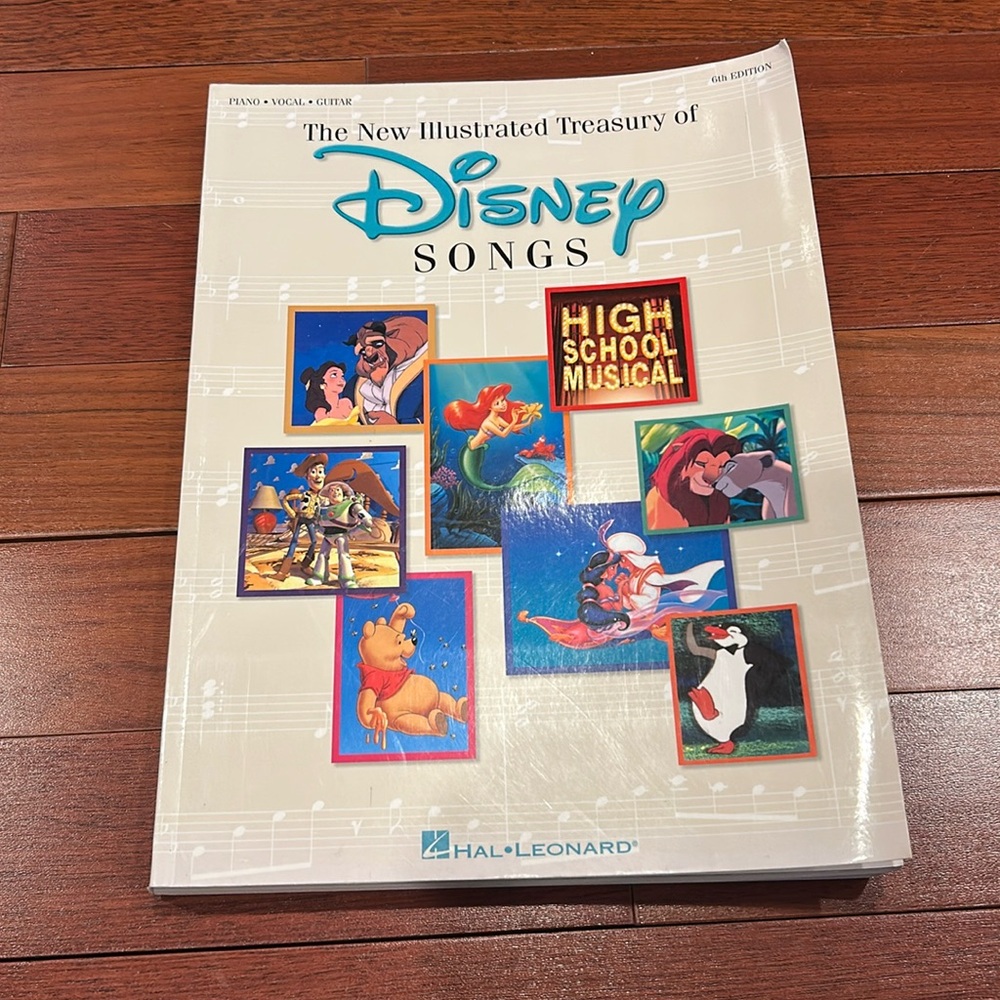 The New Illustrated Treasury of Disney Songs by Hal Leonard Corp Paperback